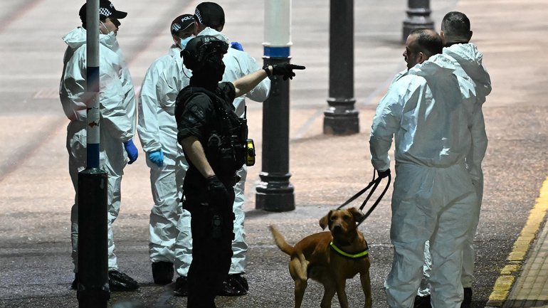 Police officers on the platform at Huntingdon Station.