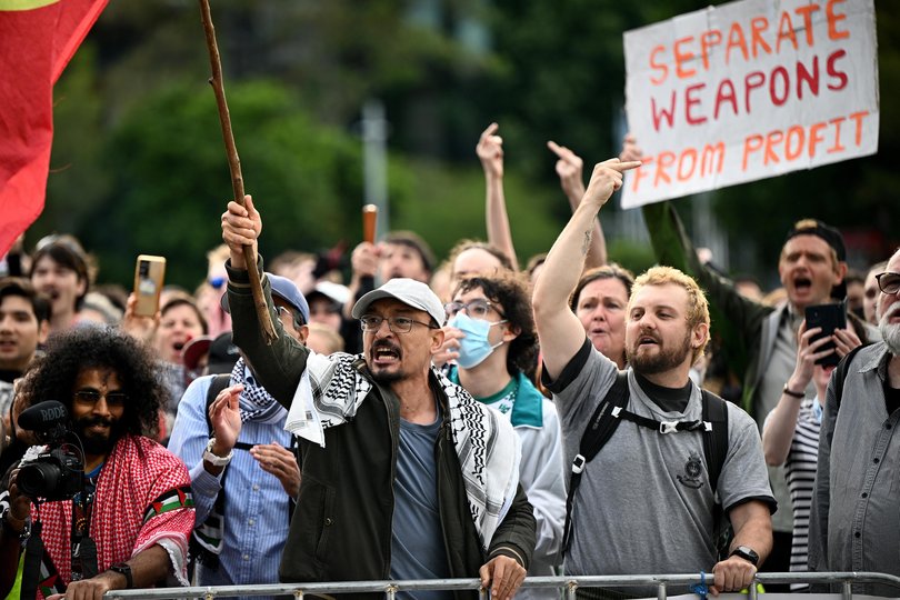 Protesters hold placards during an attempted blockade by the Palestine Action Group of the Indo-Pacific Weapons expo at the ICC Sydney.