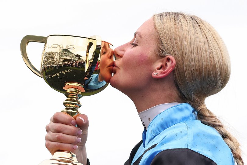 Jamie Melham kisses the Melbourne Cup.