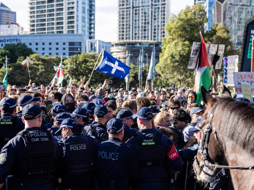 Protestors trying to get past police outside Sydney’s ICC on Tuesday.
