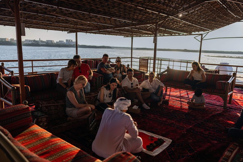 Visitors learning about pearl farming aboard a dhow at Suwaidi Pearl Farm in Ras al Khaymah.
