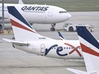 Rex Airlines Boeing 737 planes lay idle on the tarmac at Melbourne's Tullamarine Airport.