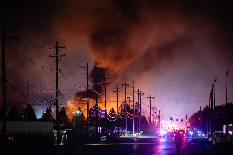 Plumes of smoke rise from the area of a UPS cargo plane crash at Louisville Muhammad Ali International Airport, on Tuesday, Nov. 4, 2025.