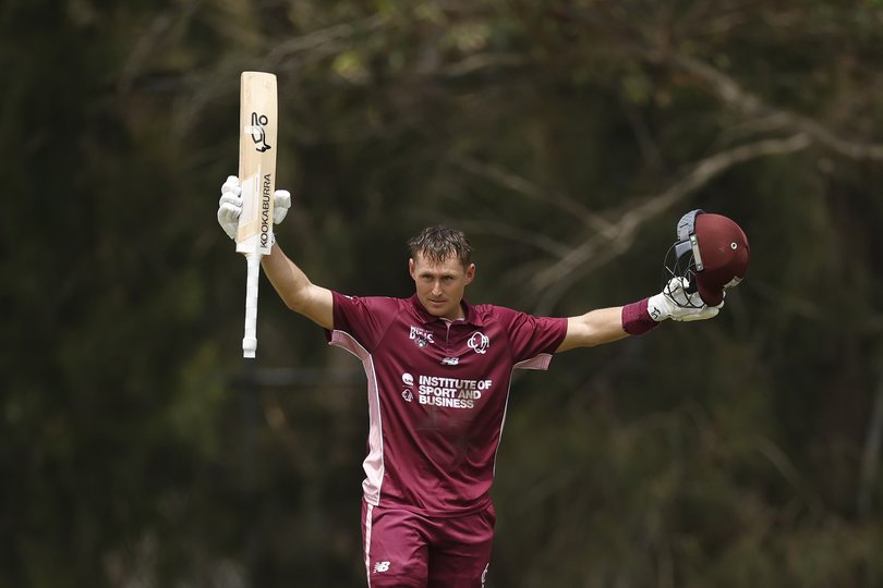 Marnus Labuschagne of Queensland raises his bat after scoring 100 runs during the One Day Cup match between New South Wales and Queensland.