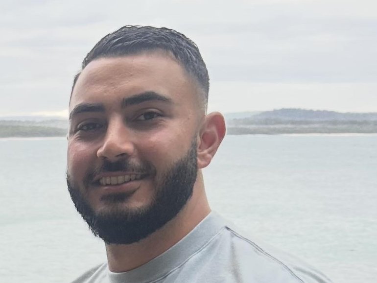 Two men have been charged with murdering Sydney plumber John Versace, who was shot dead after being mistaken for a gangland figure.