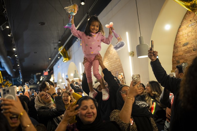 Supporters of state Assemblyman Zohran Mamdani, the Democratic candidate for mayor of New York City, react after his victory was announced during an election night watch party.