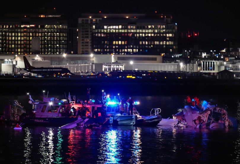 Emergency divers respond after a passenger aircraft collided with a helicopter, in the Potomac River near Ronald Reagan Washington Airport.