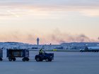 The ATC tower is seen while smoke continues to rise from the crash site of UPS Flight 2976 near Louisville Muhammad Ali International Airport.