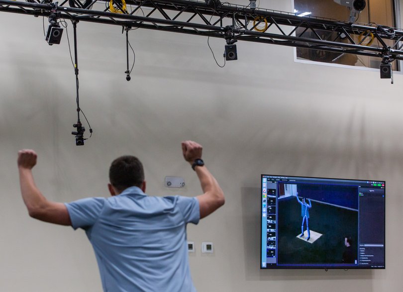 An athlete at Biocore stands in front of cameras and has his stance captured at the lab. MUST CREDIT: Cal Cary/For The Washington Post