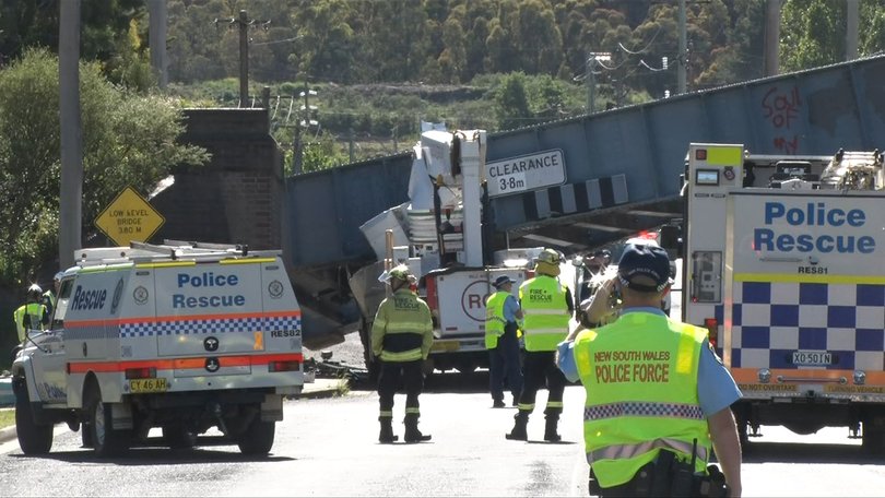 A bridge has collapsed onto a cherry picker after the vehicle crashed into it.