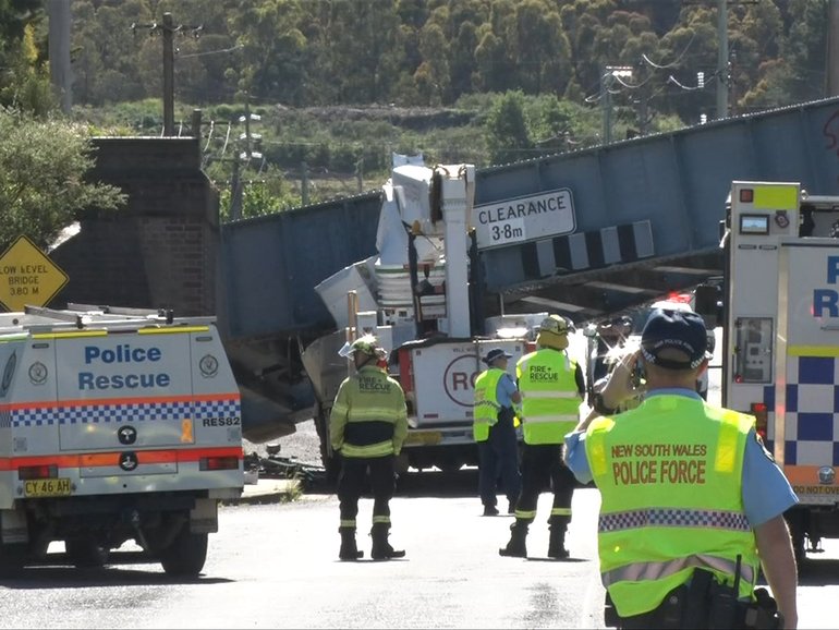 A bridge has collapsed onto a cherry picker after the vehicle crashed into it.