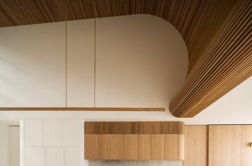 Curves are also on show in this architecturally-designed kitchen, built by Heliconia and Stratt Building Group.