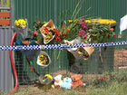 Floral tributes at the scene of the Emerald house fire, which claimed four lives.