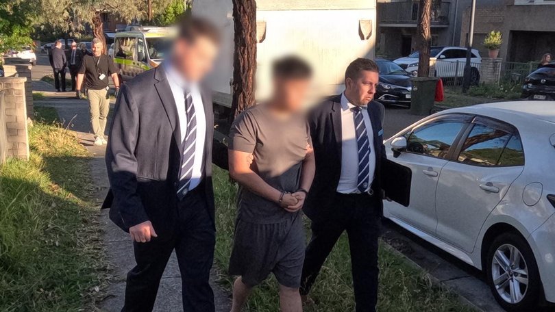 A NAB worker is accused of being part of a criminal syndicate that secured $10m of dodgy loans.