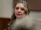 Former Richneck Elementary School teacher Abby Zwerner looks back into the courtroom during her civil lawsuit trial, Tuesday, Oct. 28, 2025, in Newport News, Va. (Stephen M. Katz/The Virginian-Pilot via AP, Pool)