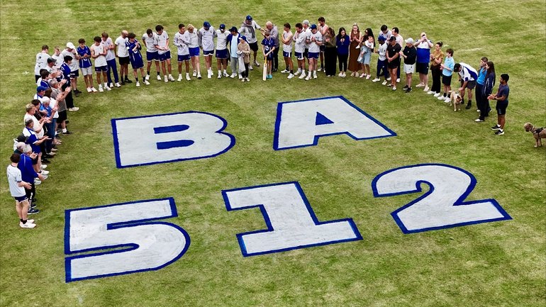 Players, coaches and supporters gathered around a tribute to Ben on the ground. 