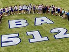 Players, coaches and supporters gathered around a tribute to Ben on the ground. 
