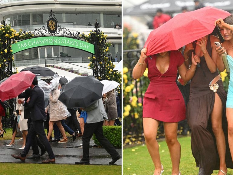 Racing fans brave the elements at Flemington.