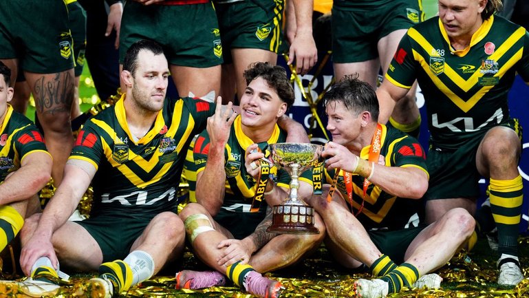 Reece Walsh celebrates after the Kangaroos completed their successful Ashes mission 