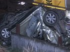 A woman has made a lucky escape after her car was hit by a train and crushed south of Brisbane. 