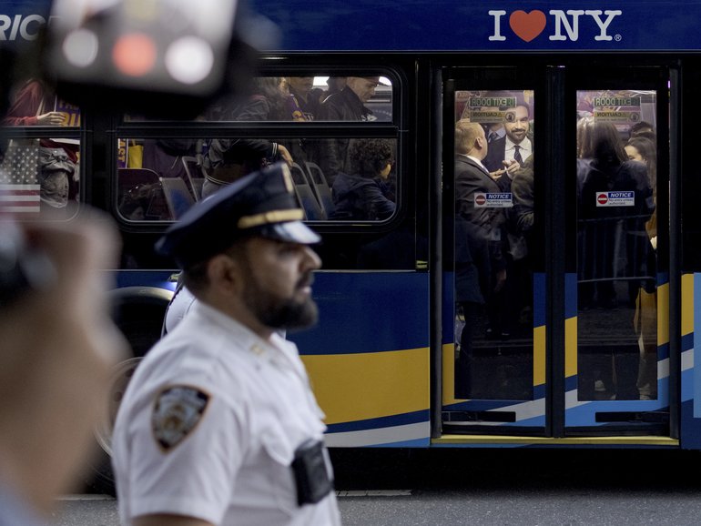 Zohran Mamdani arrives on a public bus for the second mayoral debate at the LaGuardia Performing Arts Center in Queens.