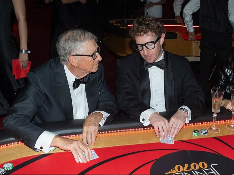 Bill Gates and Mark Zuckerberg pose at a casino table at Kris Jenner's 70th birthday party.