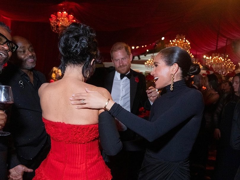 Kris Jenner with Prince Harry and Meghan Markle at her 70th birthday party.