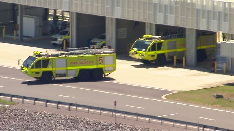 Emergency services rush to a United Airlines flight after an engine warning during takeoff.