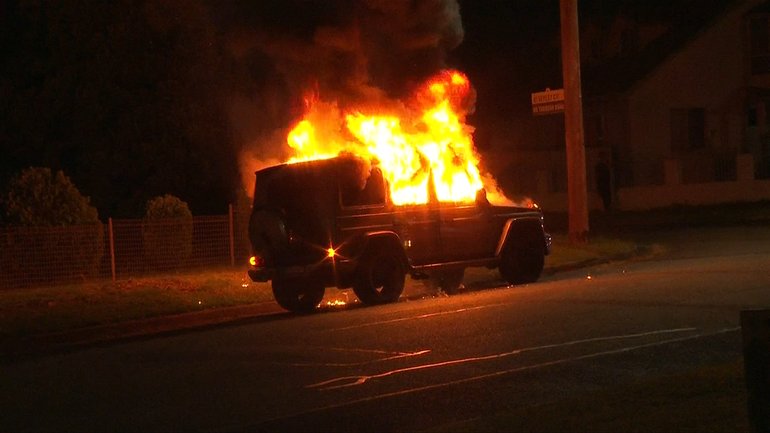 The luxury car was set alight in Chester Hill.