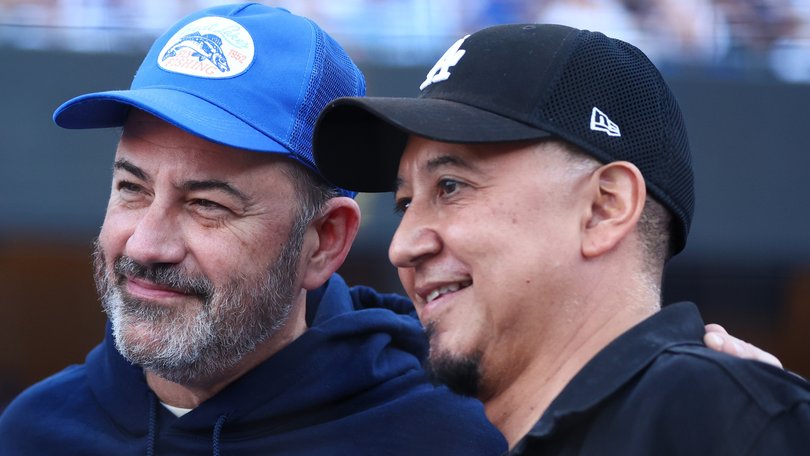 Jimmy Kimmel and Cleto Escobedo III (right) pose for a photo on the field before Game One of the 2024 World Series.