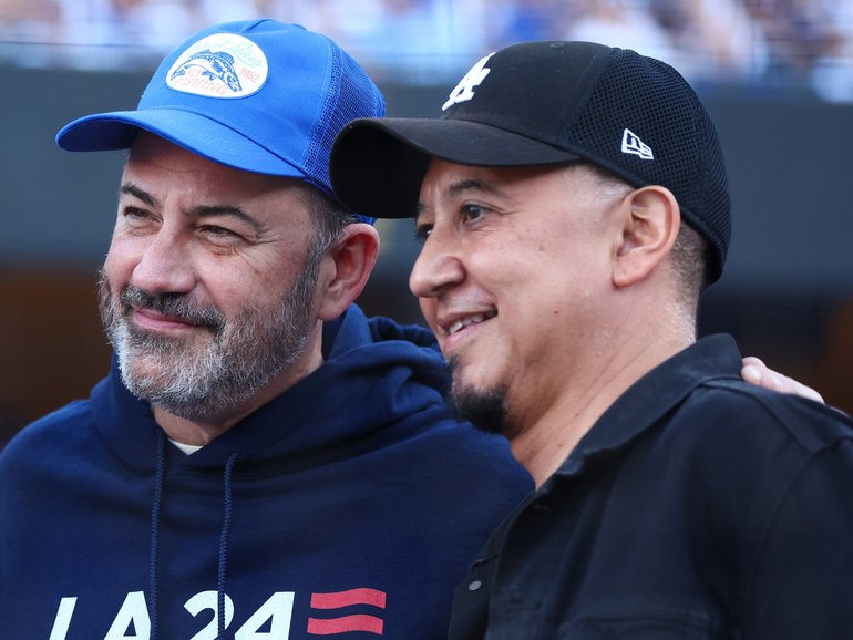 Jimmy Kimmel and Cleto Escobedo III (right) pose for a photo on the field before Game One of the 2024 World Series.