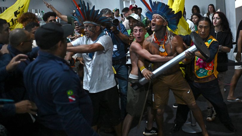 Protesters clash with security forces in an attempt to storm the COP30 headquarters in Belem, Brazil.