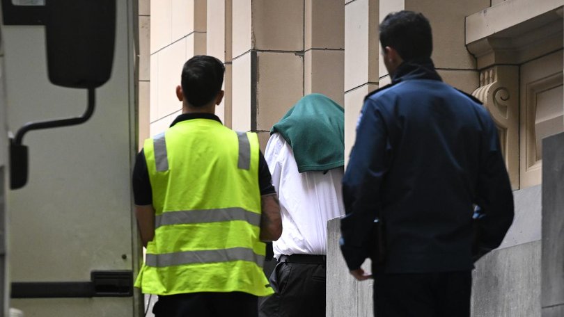 Benjamin Swann (centre) pleaded guilty to child homicide after killing his girlfriend's baby. (James Ross/AAP PHOTOS)