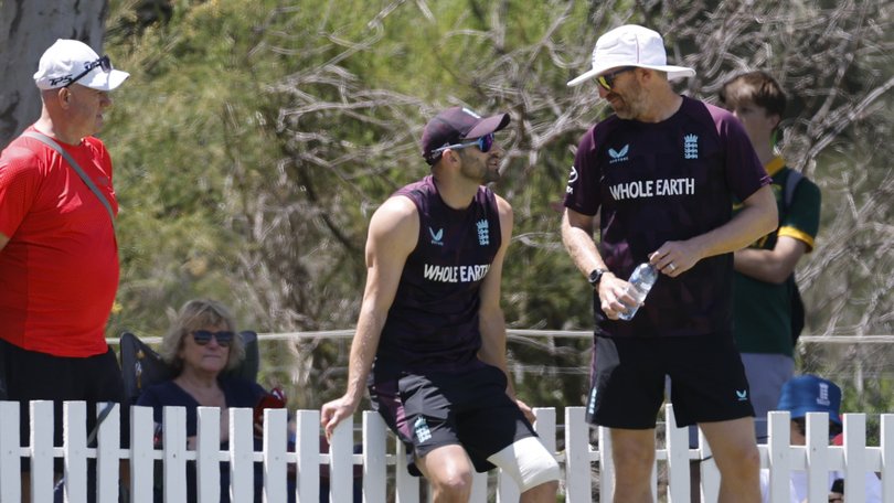 Mark Wood (2nd from right) for England watches from the boundary at Lillac Hill.