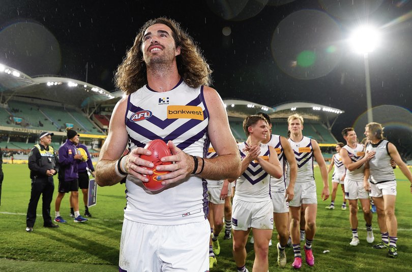 ADELAIDE, AUSTRALIA - AUGUST 09: Match winner Alex Pearce of the Dockers leads the team off after the win during the 2025 AFL Round 22 match between the Port Adelaide Power and the Fremantle Dockers at Optus Stadium on August 9, 2025 in Adelaide, Australia. (Photo by Sarah Reed/AFL Photos) 