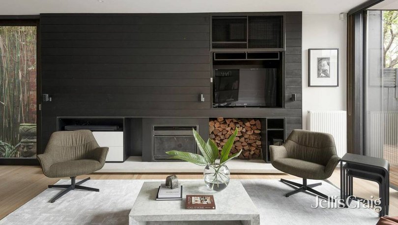 A statement fireplace is at the heart of the living room.