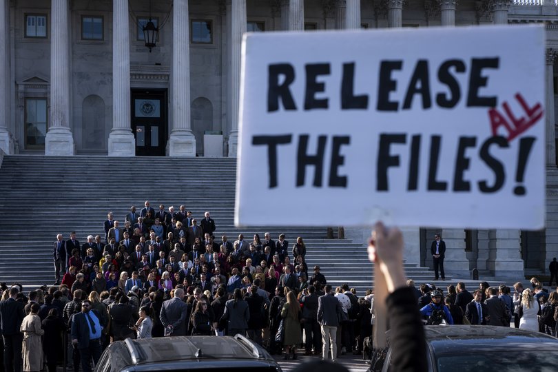A demonstrator holds a sign calling for the relese of the Epstein files as House Democrats hold a news conference on the Capitol steps in Washington.