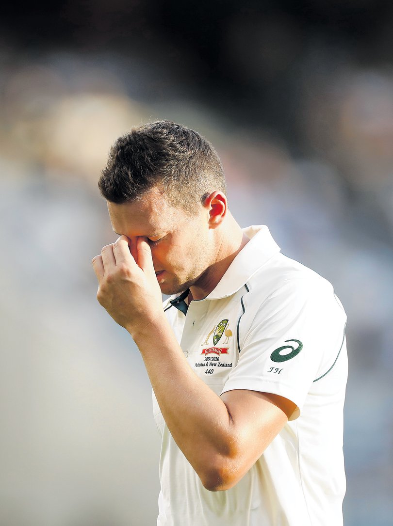 PERTH, AUSTRALIA - DECEMBER 13: Josh Hazlewood of Australia looks dejected as he leaves the ground with an injury during day two of the First Test match between Australia and New Zealand at Optus Stadium on December 13, 2019 in Perth, Australia. (Photo by Ryan Pierse/Getty Images)