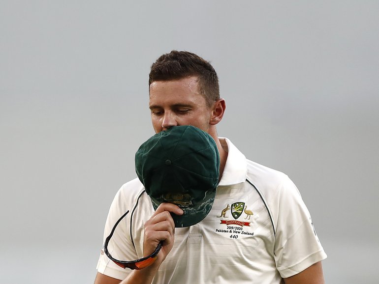 PERTH, AUSTRALIA - DECEMBER 13: Josh Hazlewood of Australia looks dejected as he leaves the ground with an injury during day two of the First Test match between Australia and New Zealand at Optus Stadium on December 13, 2019 in Perth, Australia. (Photo by Ryan Pierse/Getty Images)
