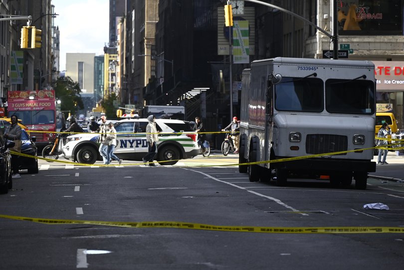 NYPD officers maintain a security cordon after New York Jets NFL cornerback Kris Boyd was shot outside a restaurant in Midtown, Manhattan.