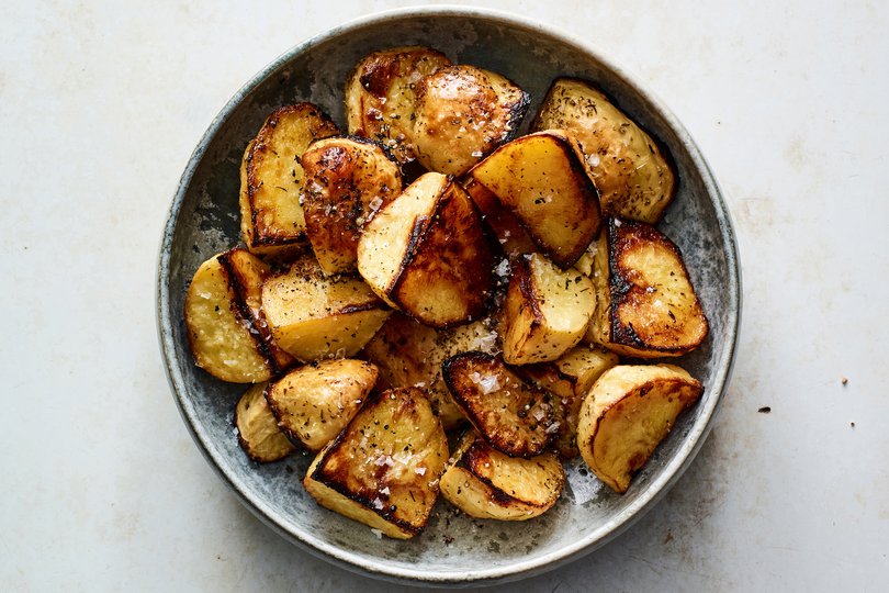 Greek lemon potatoes. Using the Greek method of roasting potatoes in olive oil, lemon juice and stock results in potatoes that are crispy outside, creamy inside and deeply flavorful throughout. Food styled by Barrett Washburne. (Andrew Purcell/The New York Times)