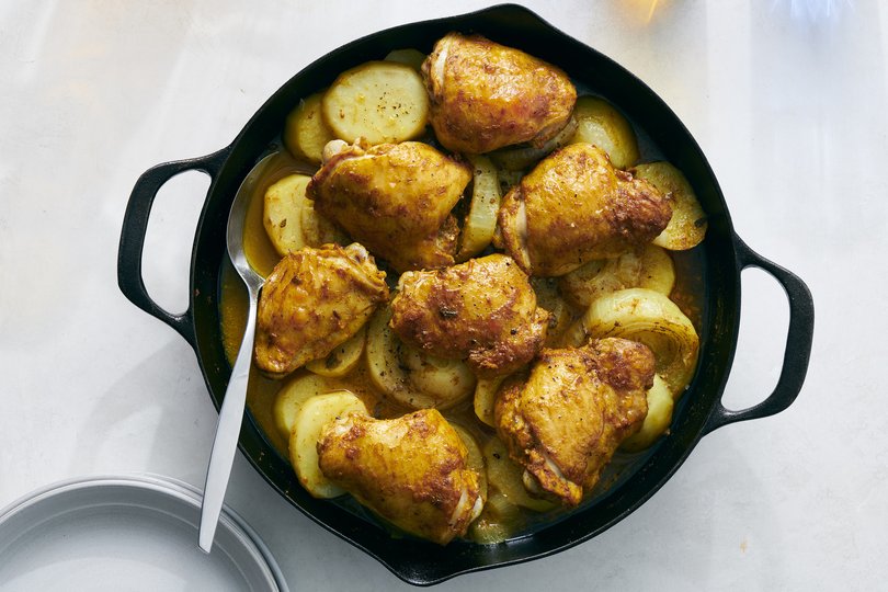 One-pan chicken with golden potatoes. In this family-friendly dinner, turmeric lends its yellow hue and earthy aroma to red potatoes, onions and chicken thighs. Food styled by Hadas Smirnoff. (David Malosh/The New York Times)