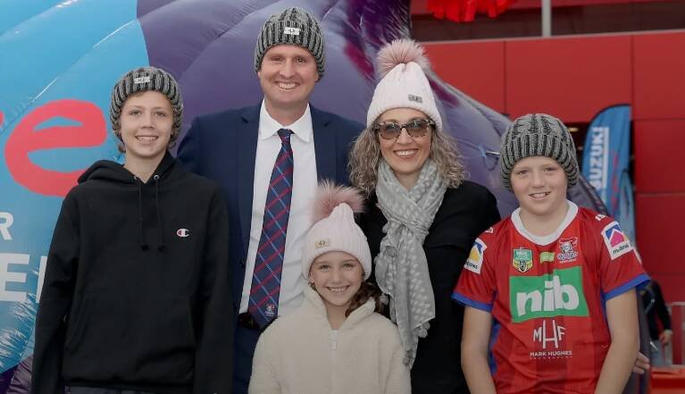 Mark and Kirralee Hughes with their three children.