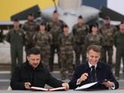 The presidents of Ukraine and France signed a deal for Kyiv to purchase 100 French-made warplanes. (AP PHOTO)