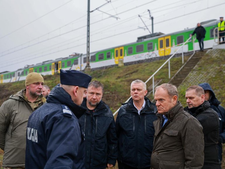 Poland Prime Minister Donald Tusk and Polish Interior Minister Marcin Kierwinski inspect the damaged railway tracks on the Warsaw-Lublin route in Poland.