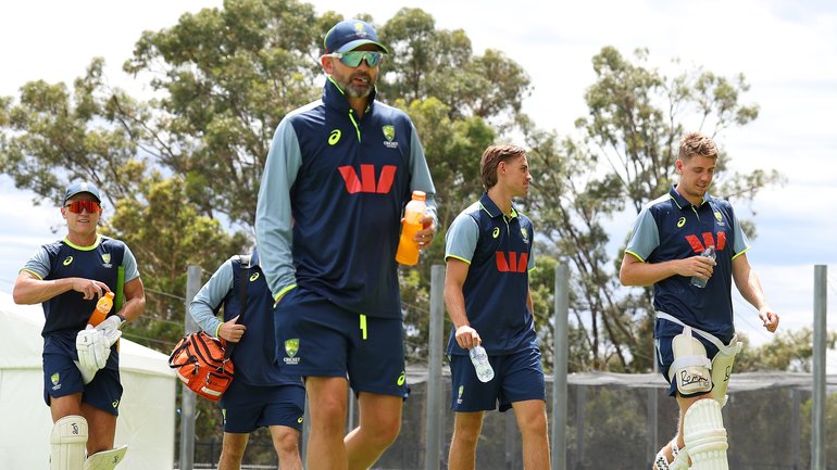 Australian players return inside because of lightning. 