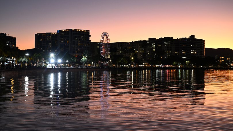 Buildings are seen on the Cairns Esplanade as the sunsets over Cairns in Queensland, Sunday, August 17, 2025. (AAP Image/Darren England) NO ARCHIVING