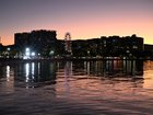 Buildings are seen on the Cairns Esplanade as the sunsets over Cairns in Queensland, Sunday, August 17, 2025. (AAP Image/Darren England) NO ARCHIVING