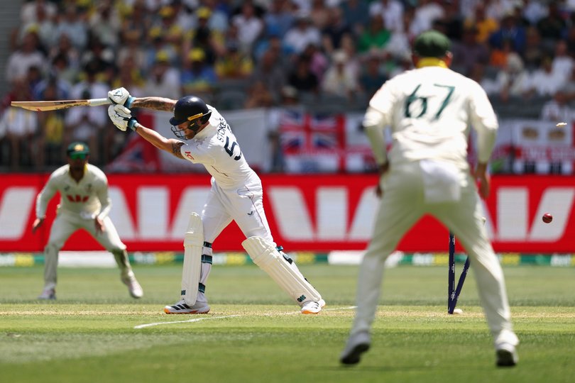 PERTH, AUSTRALIA - NOVEMBER 21: Ben Stokes of England is bowled out by Mitchell Starc of Australia during day one of the First 2025/26 Ashes Series Test Match between Australia and England at Perth Stadium on November 21, 2025 in Perth, Australia. (Photo by Cameron Spencer/Getty Images)