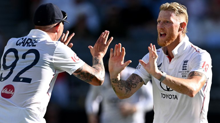 England captain Ben Stokes celebrates with Brydon Carse after dismissing Travis Head.
